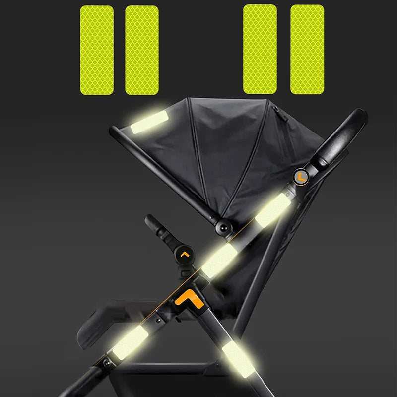 Stroller Reflective Patch - Stroller with 4 reflective green patches attached to it side and above canopy. There is also 4 green amplified size patches on the top of picture to see it's patterns.